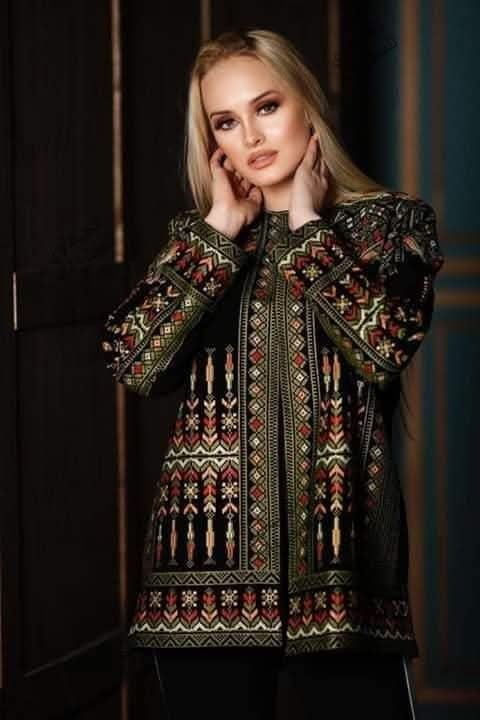 A hand-embroidered heritage jacket featuring traditional Arabic designs, in blac