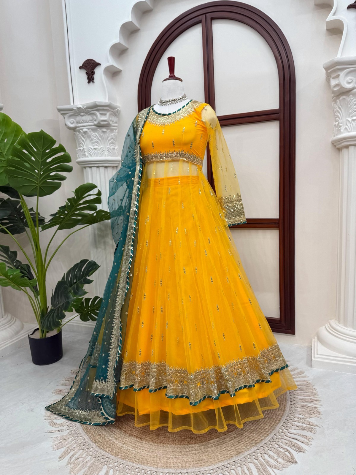Bollywood Style Soft Net Yellow Top Lehenga With Dupatta For Reception Wear