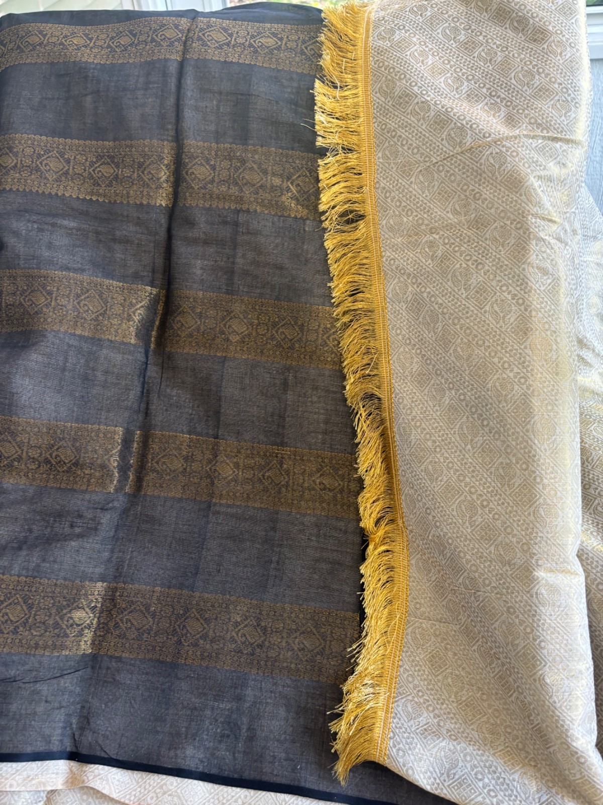 Cream and black cotton saree with zari work with fall and pico.