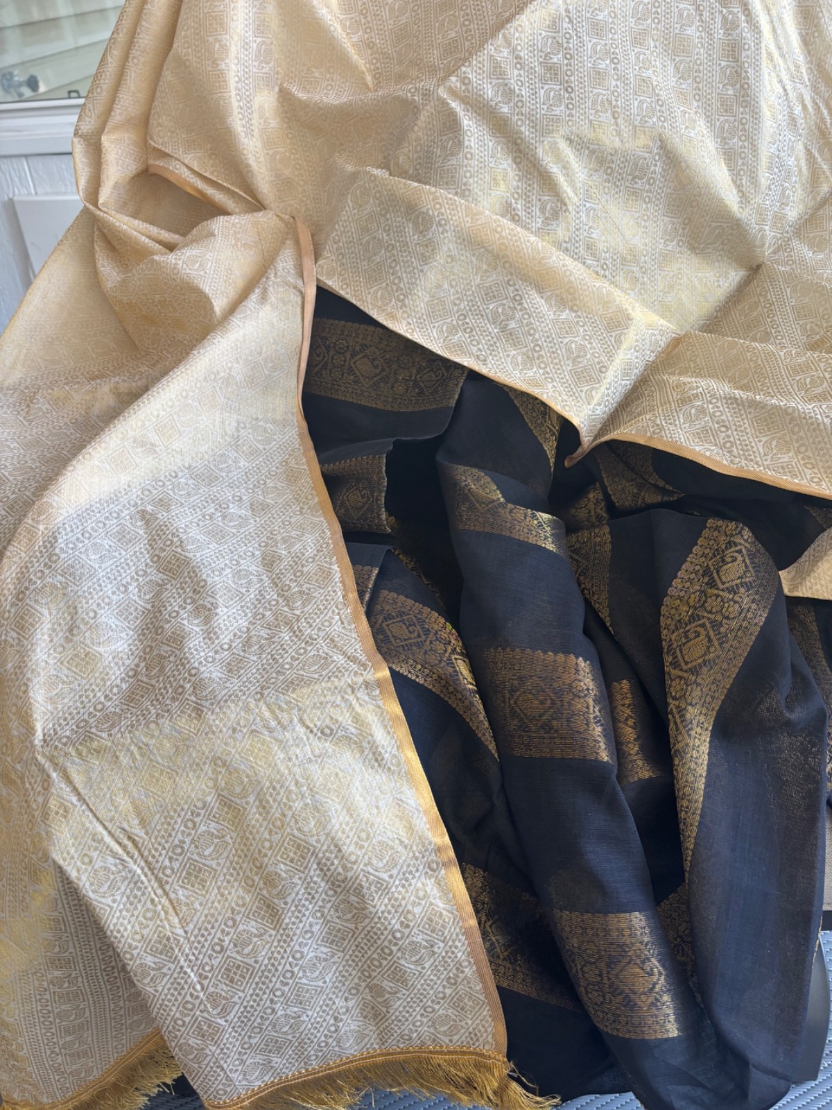 Cream and black cotton saree with zari work with fall and pico.